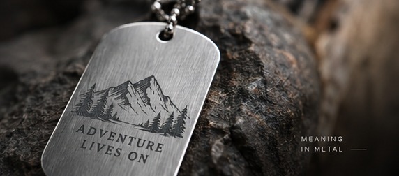 Laser engraved metal dog tag with mountain artwork
